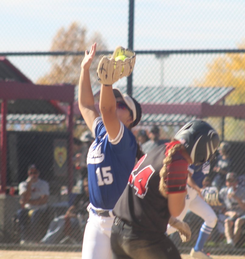FLHS' Rozzie Mendoza snares this throw while avoiding Strasburg's Autumn Stone during the first round of the state 3A softball tournament at Aurora Sports Park Oct. 21.